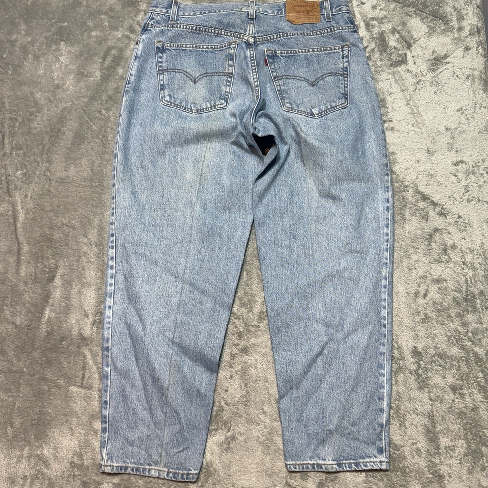 Vintage Levis 560 Loose Fit Tapered Leg Jeans Mens 38x30 Light Wash Blue 2002